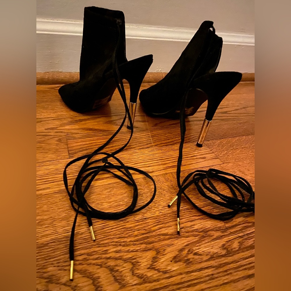 Super cute and stylish black and gold tie up heals
